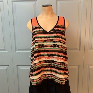 Beautiful sleeveless blouse.